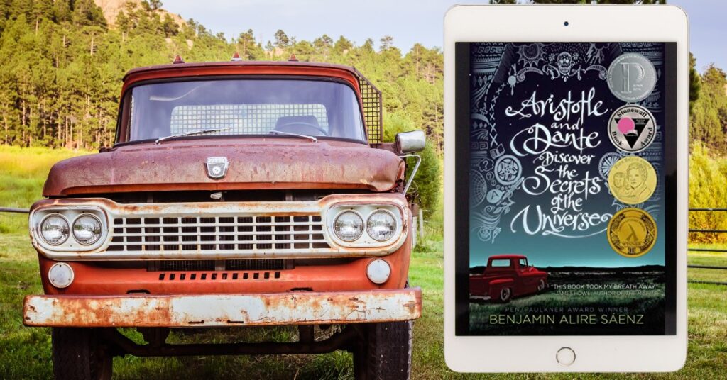 Old Truck beside an Ereader displaying the cover of Aristotle and Dante Discover the Universe