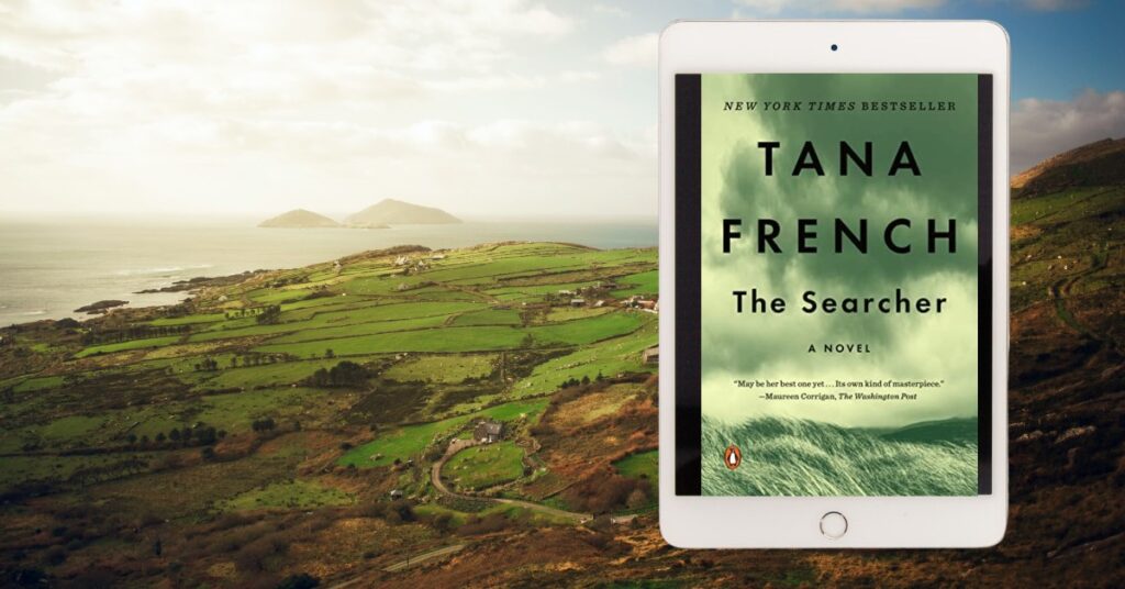 Ireland in background with eReader showing cover of The Searcher