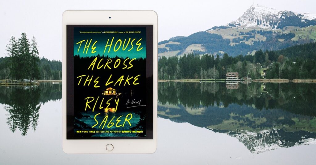 A lake house with an eReader displaying The House Across the Lake