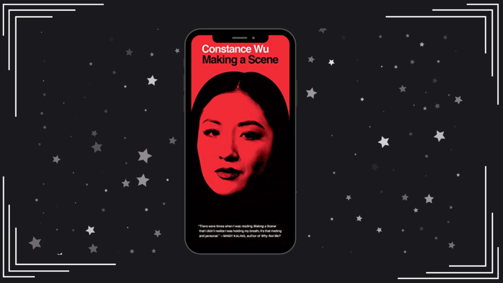 A black background with silver stars in the middle is a cell phone displaying the cover of Making a Scene, a red cover with Constance Wu in black