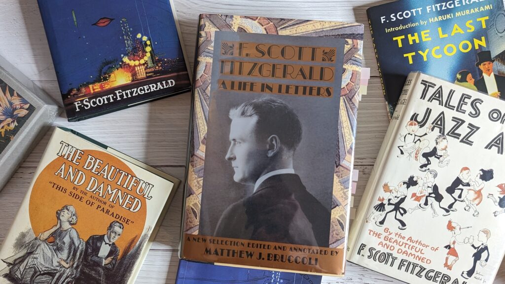 A copy of "F. Scott Fitzgerald: A Life in Letters" situated among other books of F. Scott Fitzgerald